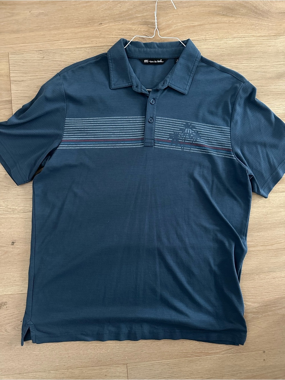 Travis Mathew Navy Polo with Horizontal Stripe Accent